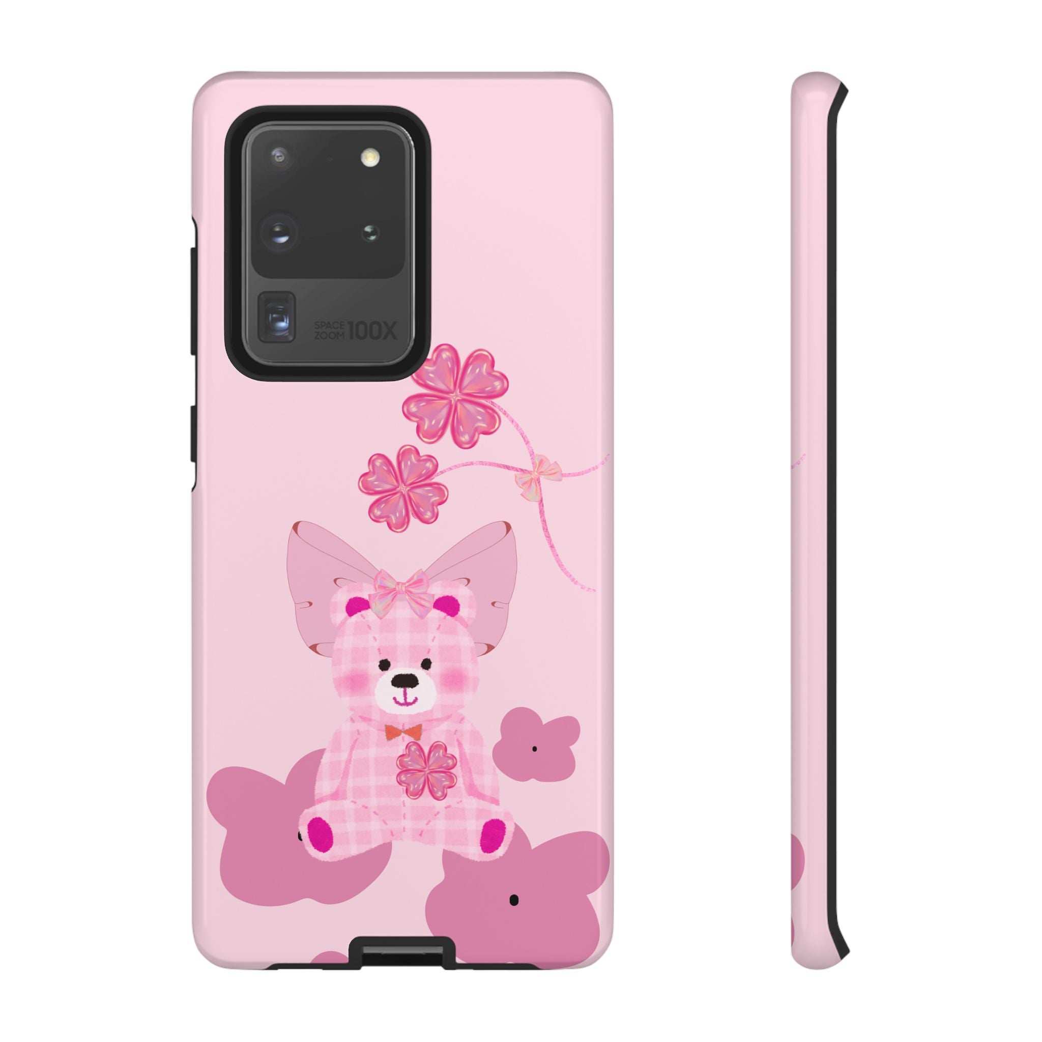 Pink phone case with teddy bear and bow; cutouts for dual camera and flash.