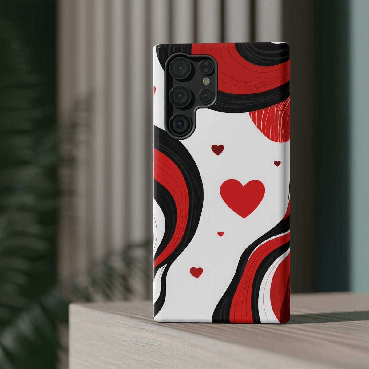 Glossy phone case with red, black, and white swirls and small red heart pattern.