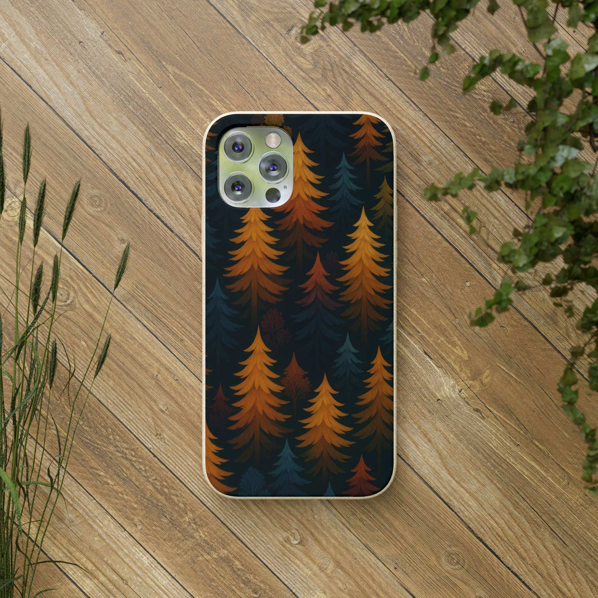 Phone case with dark forest tree pattern and speckled beige rim, camera cutouts visible