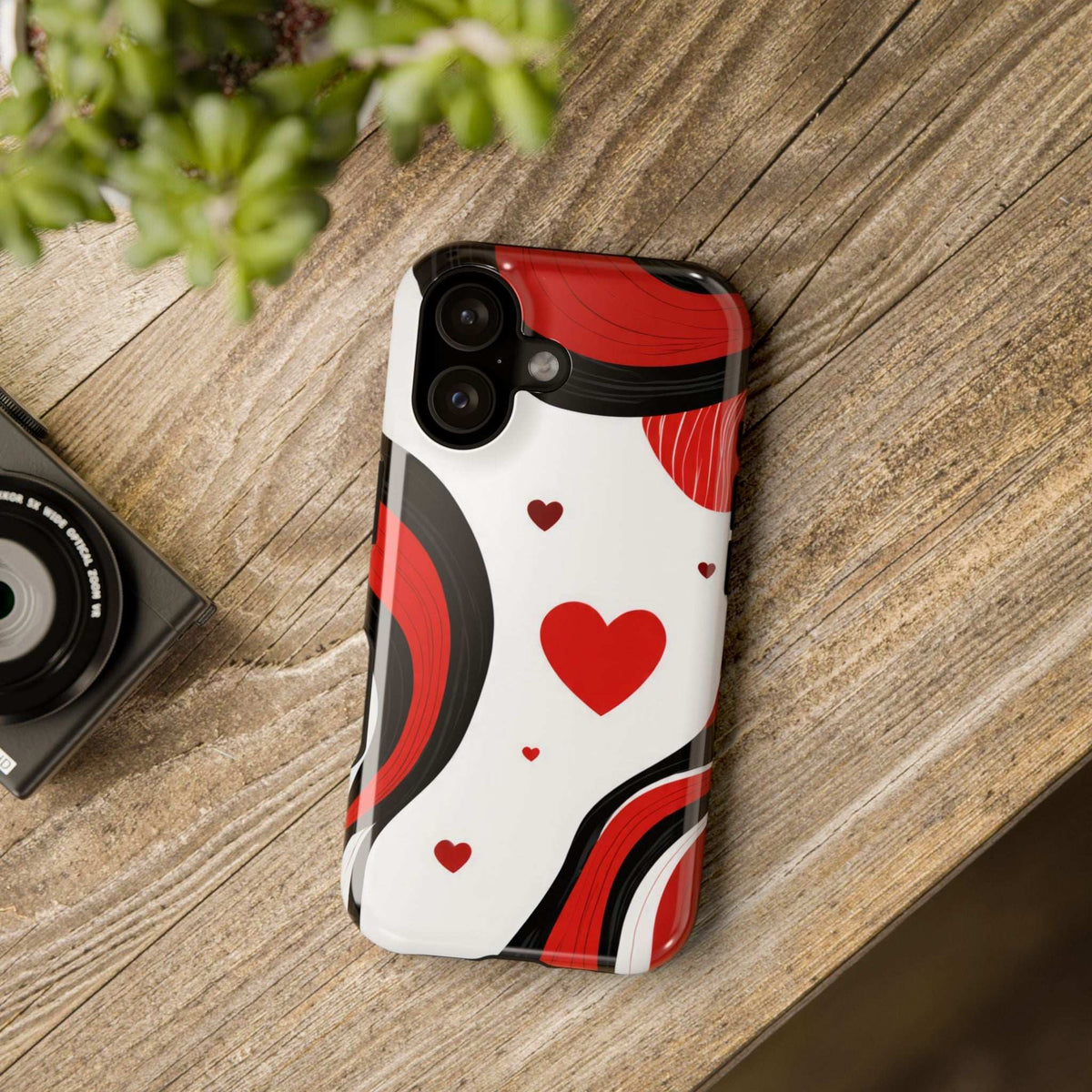 Glossy phone case with white base and red heart and wave pattern, with camera cutouts