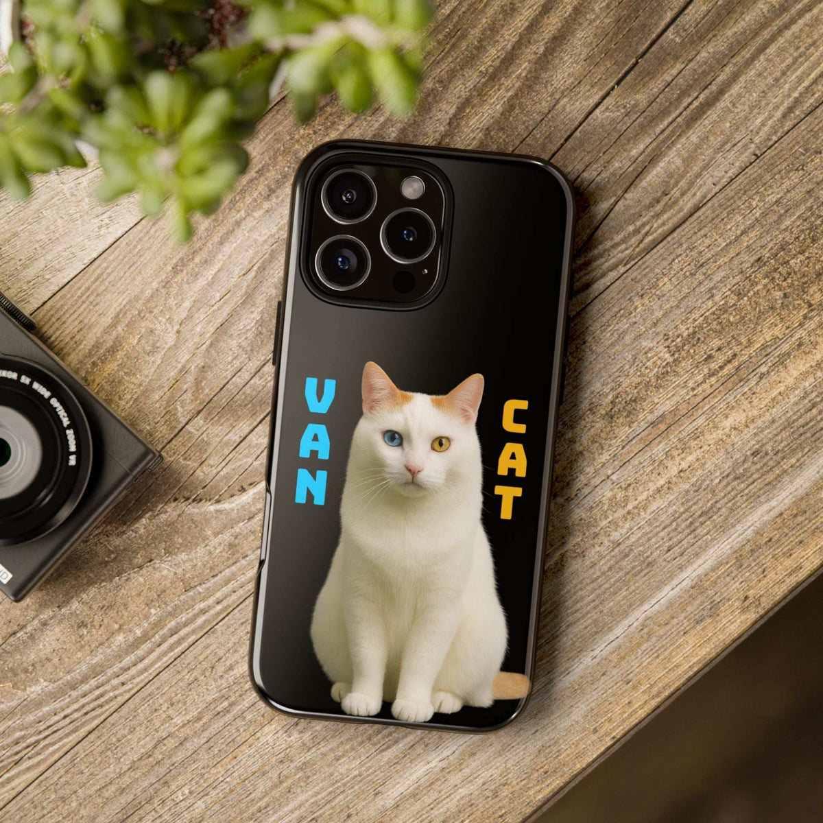 Black glossy phone case with white cat graphic, rear cameras, and side openings