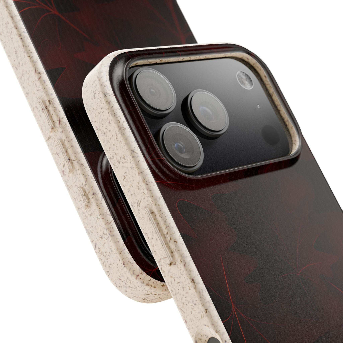 Dark phone case with red leaf pattern and raised quad camera cutout