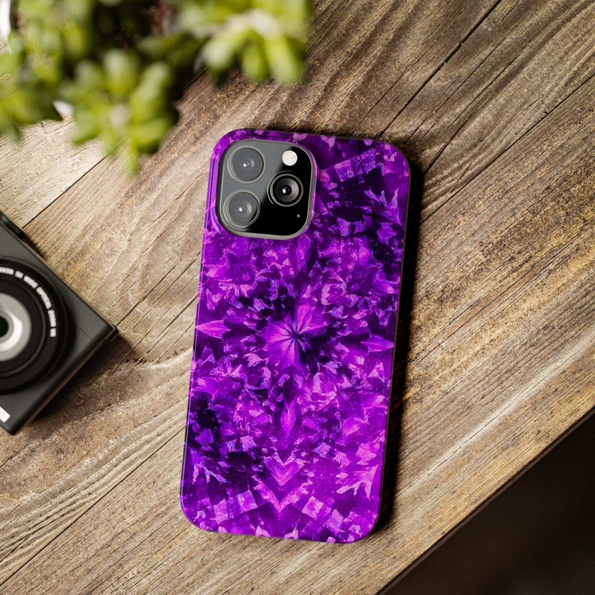 Purple kaleidoscope phone case with flowerburst pattern and rear camera cutouts