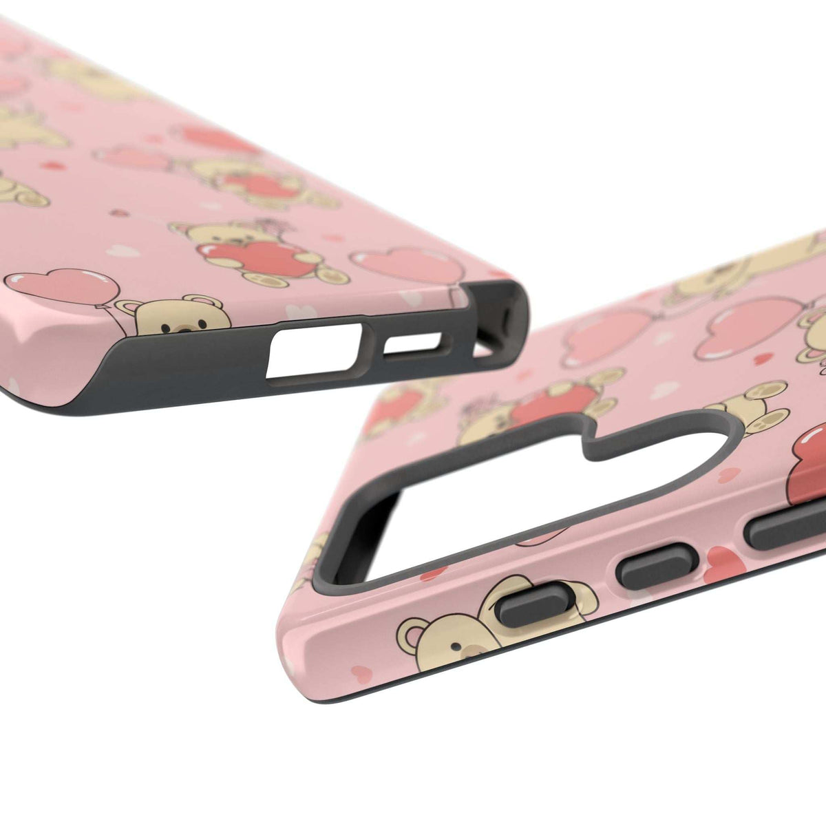 Pink phone case close-up showing speaker and charging port cutouts with black bumper