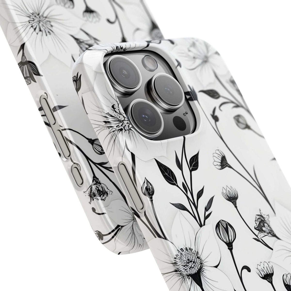 Monochrome floral phone case close-up showing camera lenses and flower print.