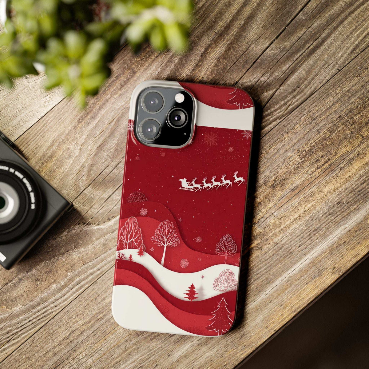 Winter festive iPhone 11-17 phone case, red with snow trees and reindeer scene