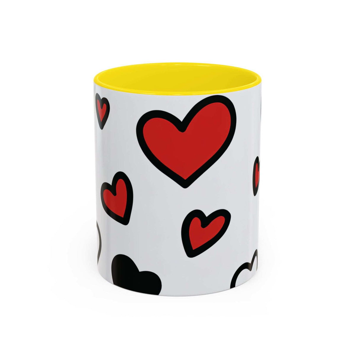 Accent coffee mug with yellow interior and rim, white body with red and black heart prints