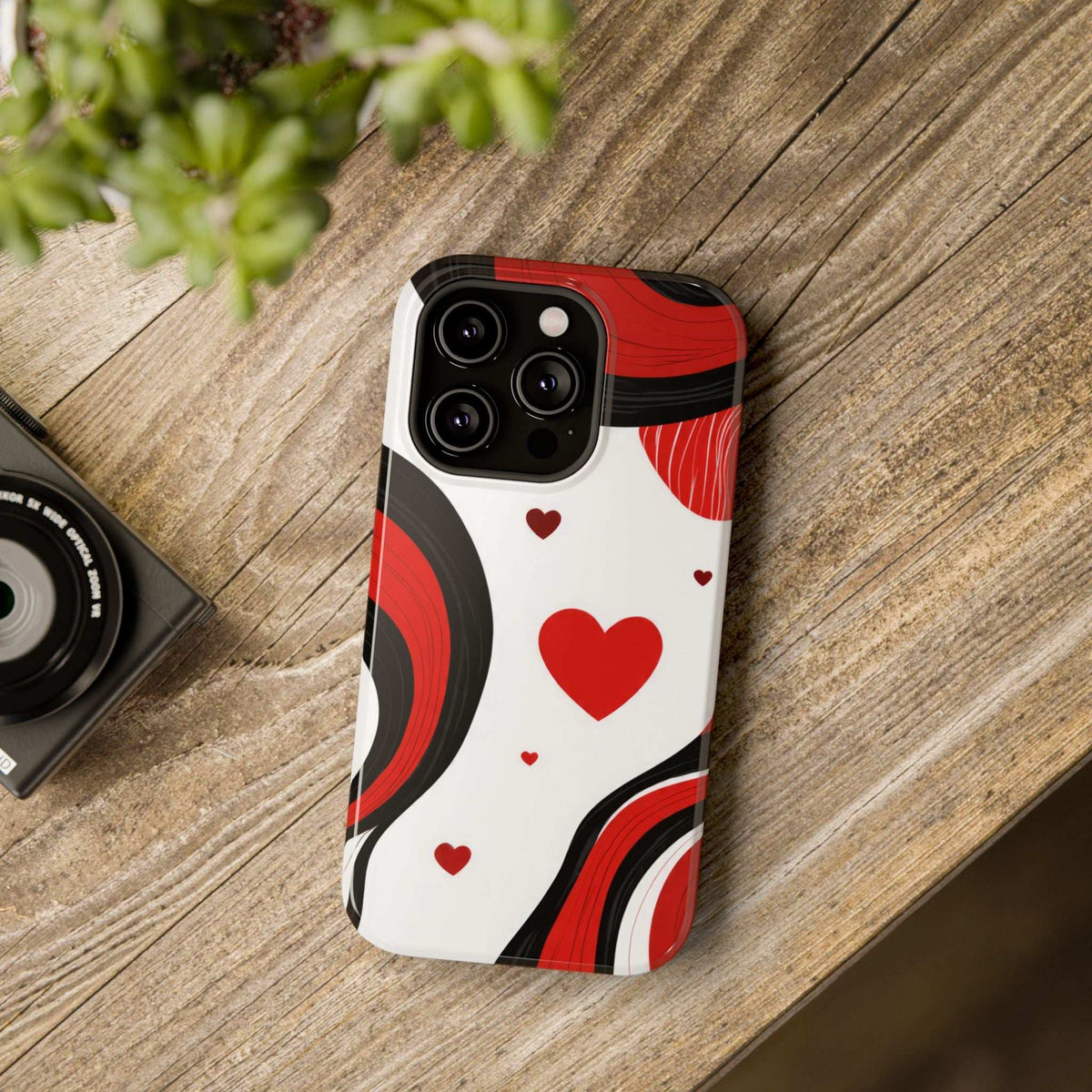 Glossy phone case back view with red hearts and curved red swirls on white