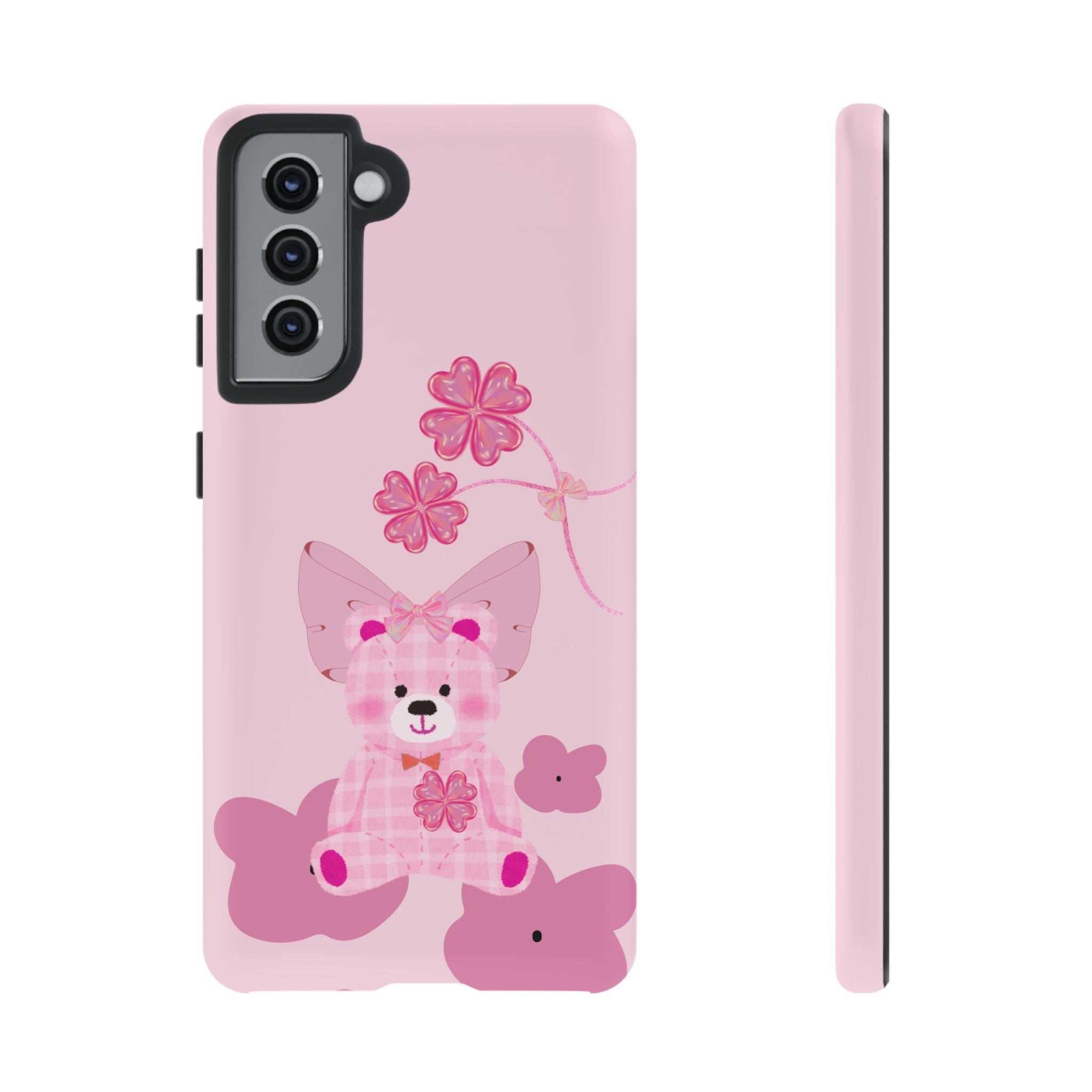 Pink teddy bear phone case with bow and flowers; triple camera module and side buttons.