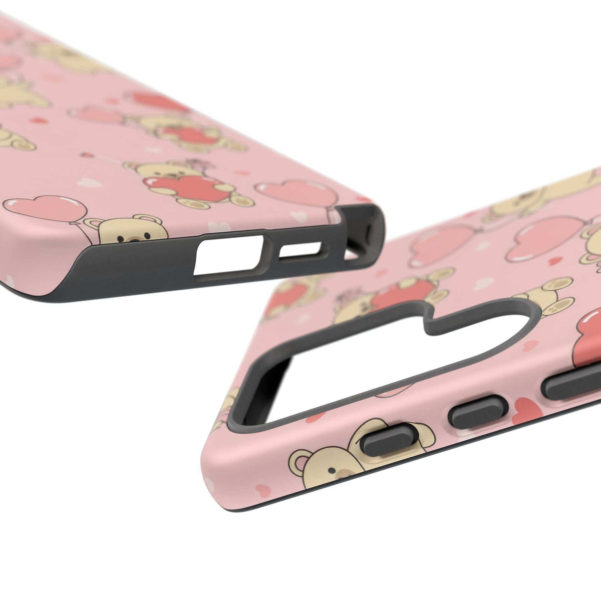 Pink phone case close-up with black bumper and port openings for speaker and charger