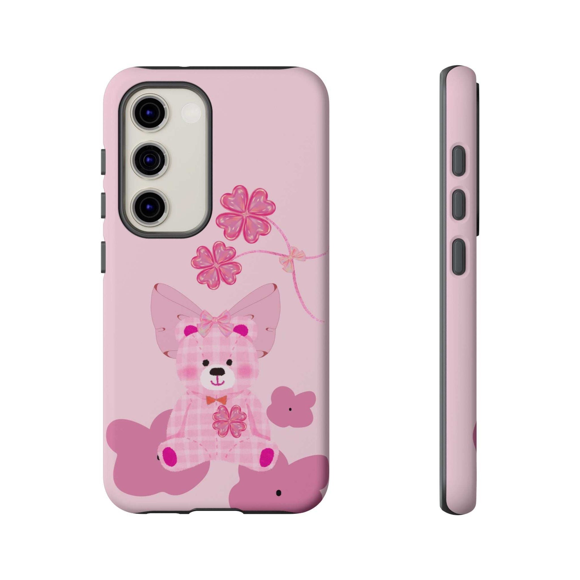 Pink phone case with teddy bear and pink flower graphic; side profile view