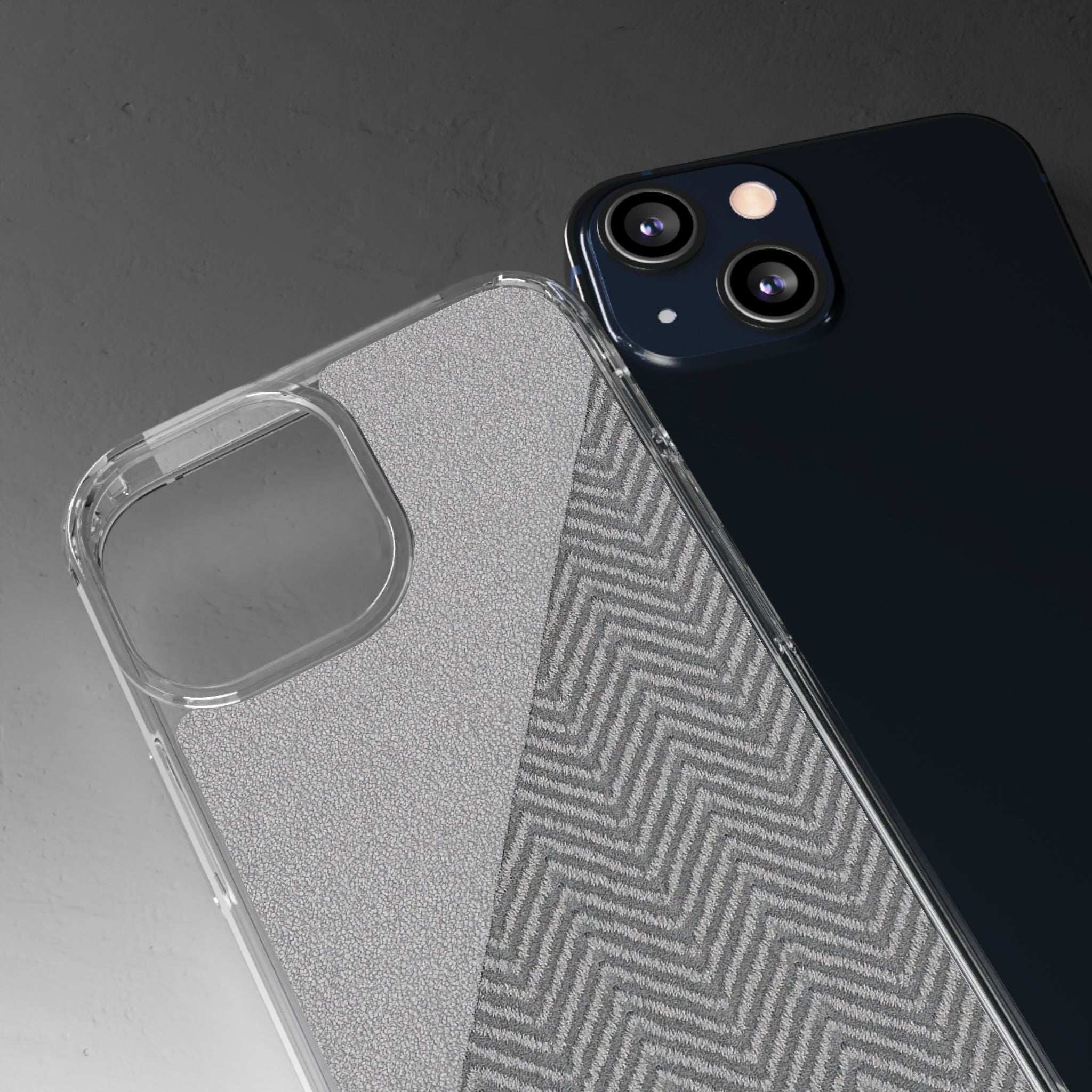 Clear tough phone case with dark herringbone pattern and raised camera cutouts