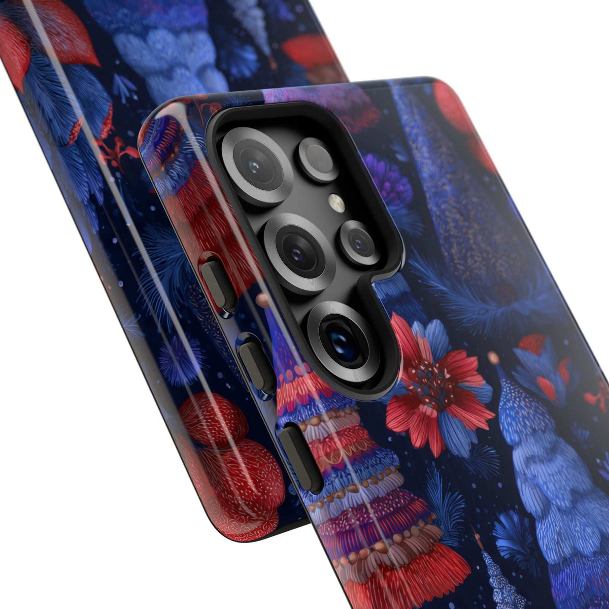 Glossy phone case close-up of camera area with midnight blue trees and red ornaments.