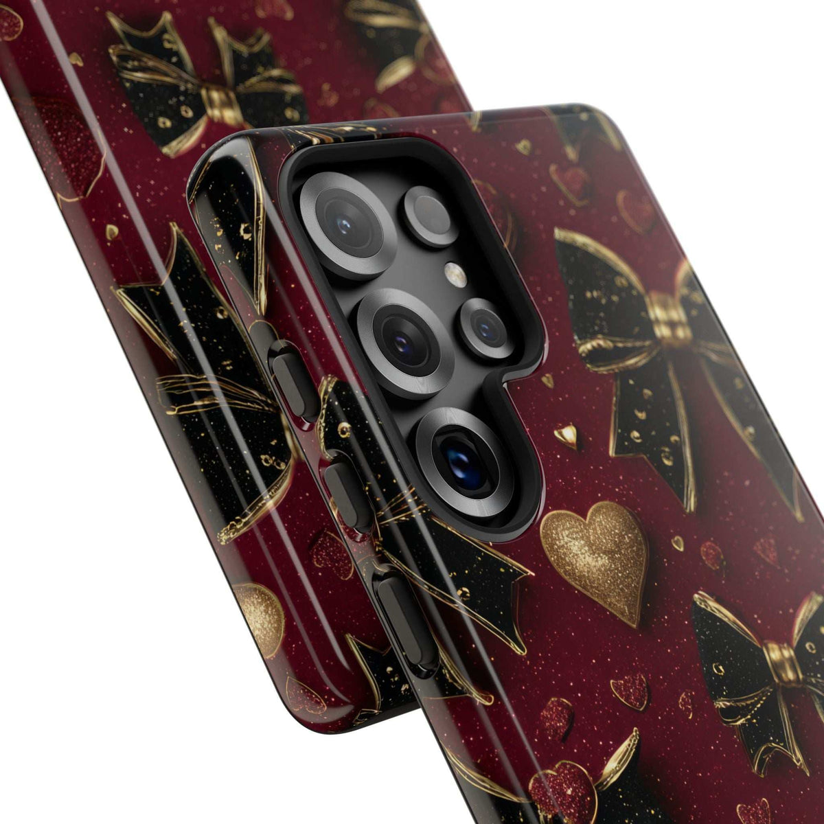Glossy burgundy phone case with gold hearts and bows, protective lens openings