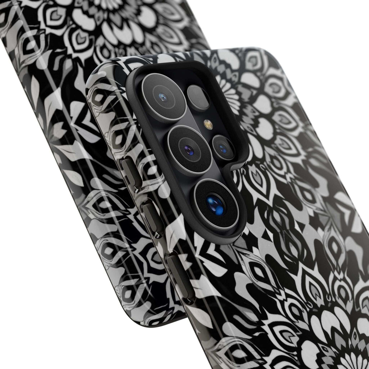 Mandala phone case with black-and-white floral pattern; raised camera cutouts