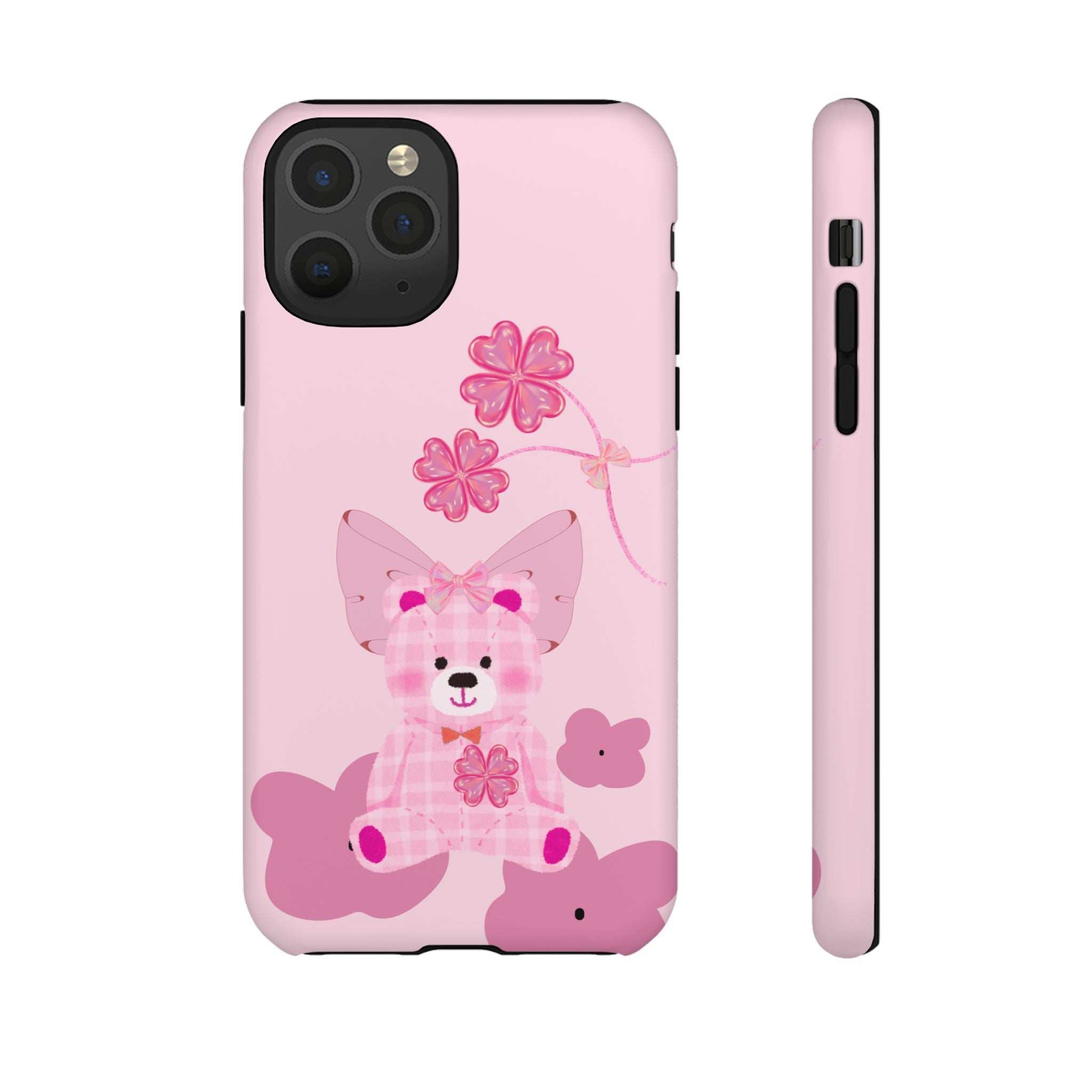 Pink teddy bear phone case with flower details; back plus side profile with port openings.