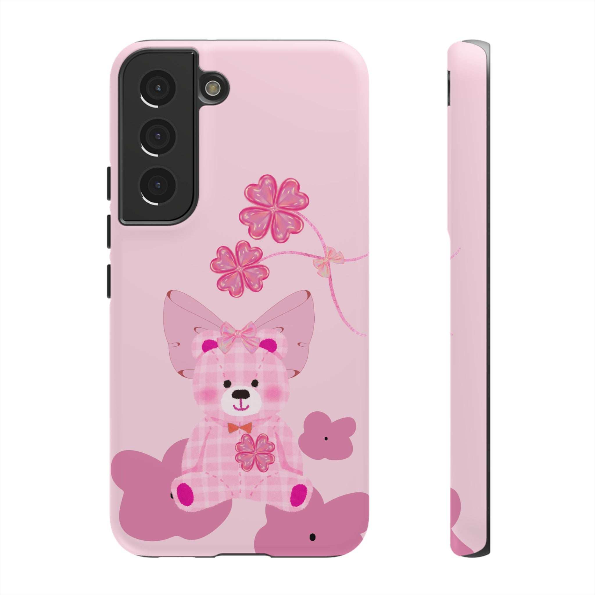 Pink phone case with teddy bear design and pink flowers; camera cutout and side edge.