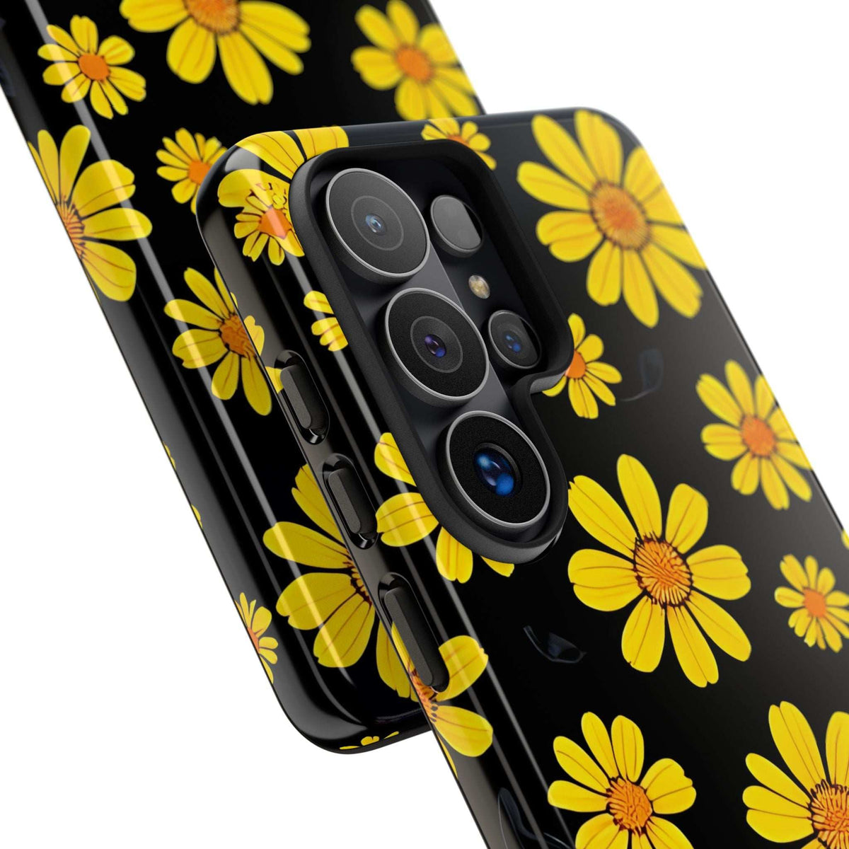Slanted view of black phone case with yellow daisy floral pattern and lens covers