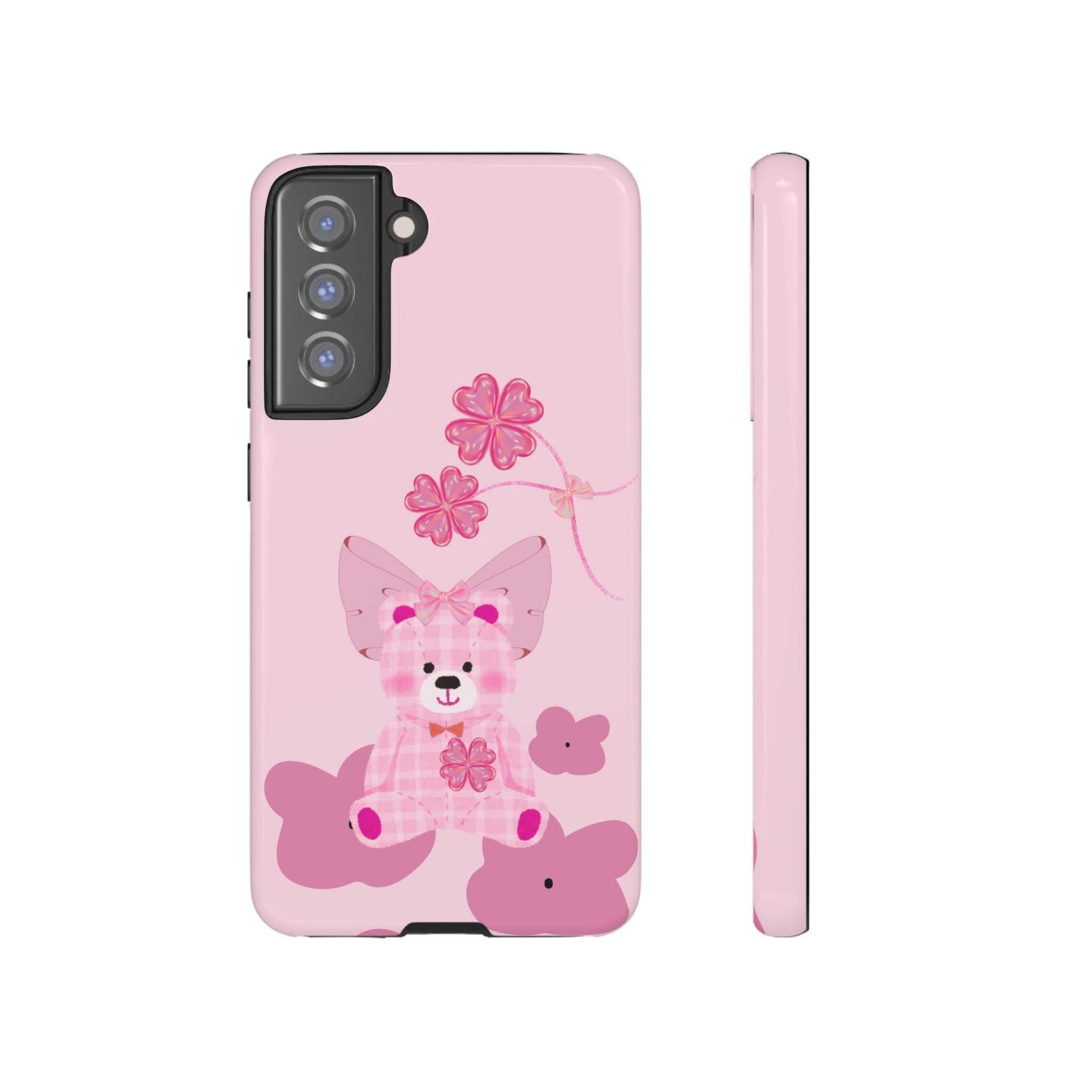 Pink phone case with teddy bear and flower graphic, back corner and side edge