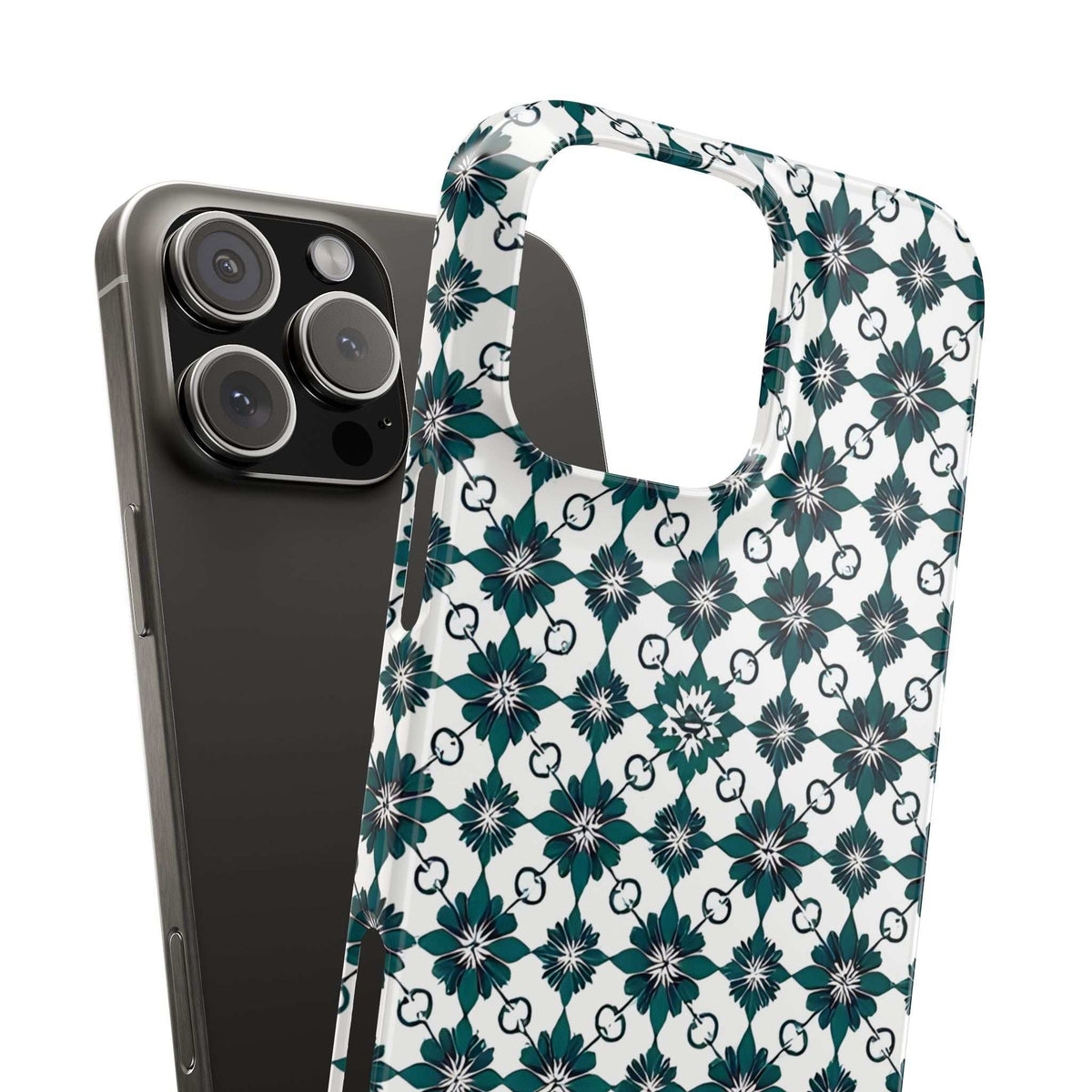Teal floral geometric phone case on white next to black phone, camera module visible