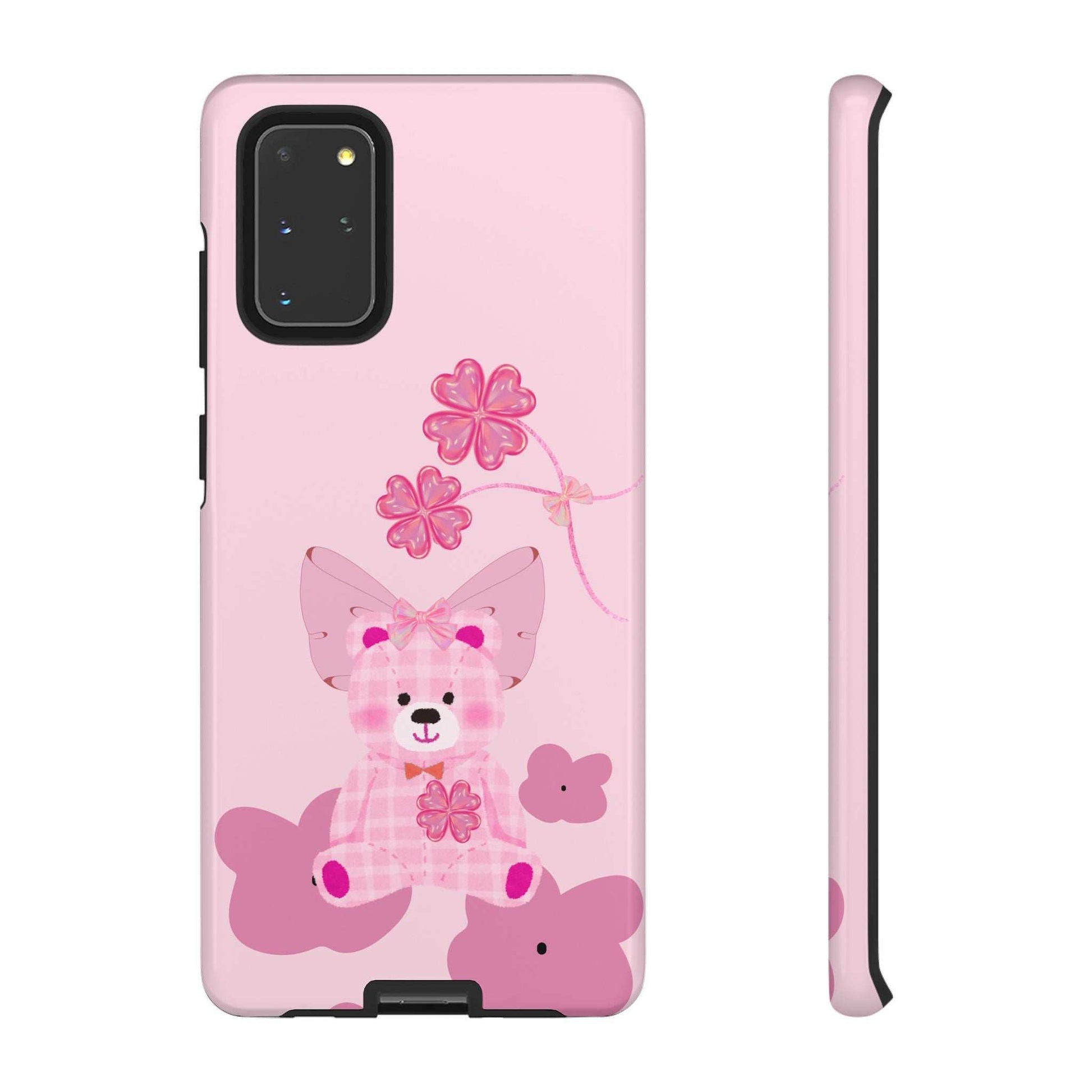 Pink phone case featuring a teddy bear with bow and flower vine; dual camera cutout.