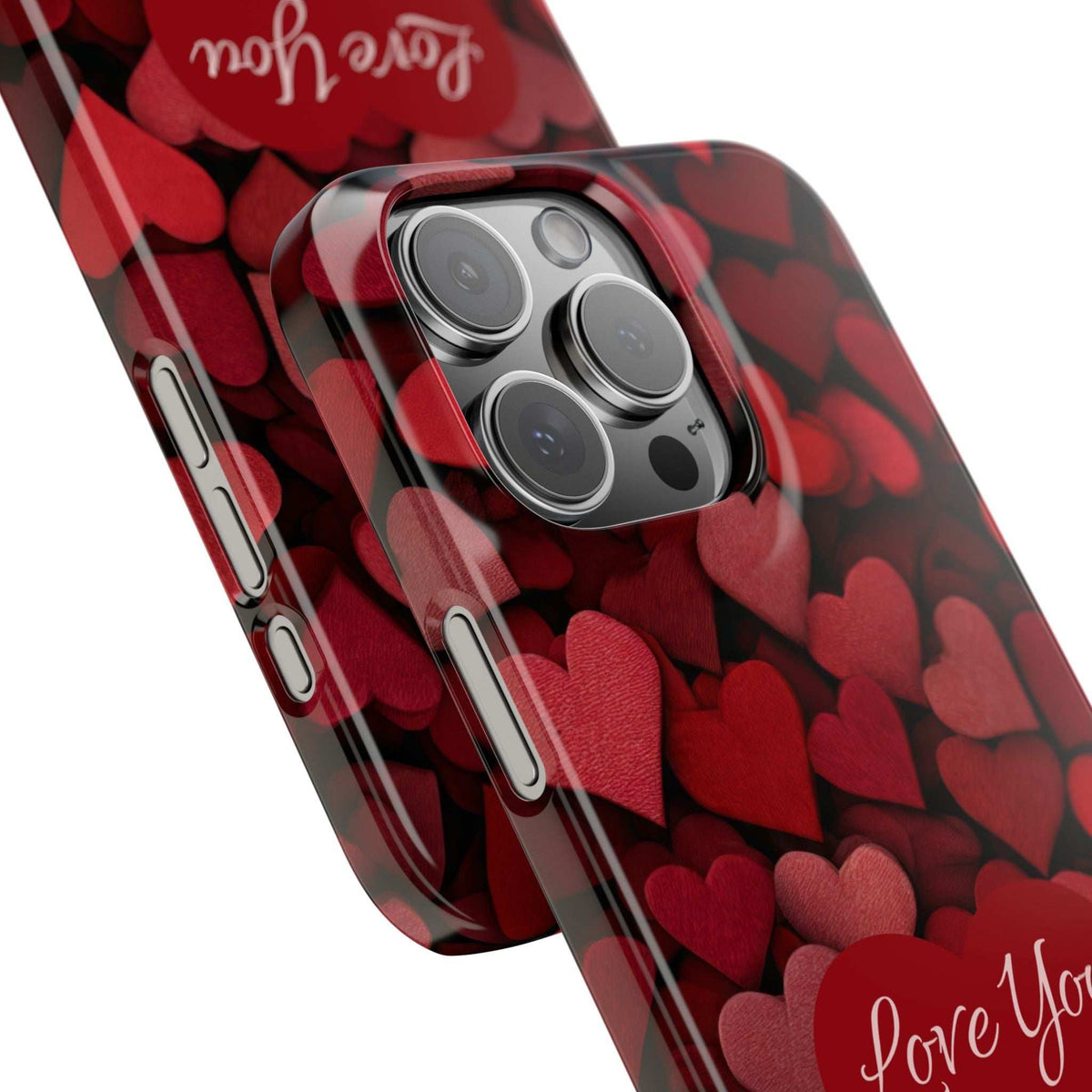 Red heart pattern phone case showing side buttons cutouts and “Love You More” text