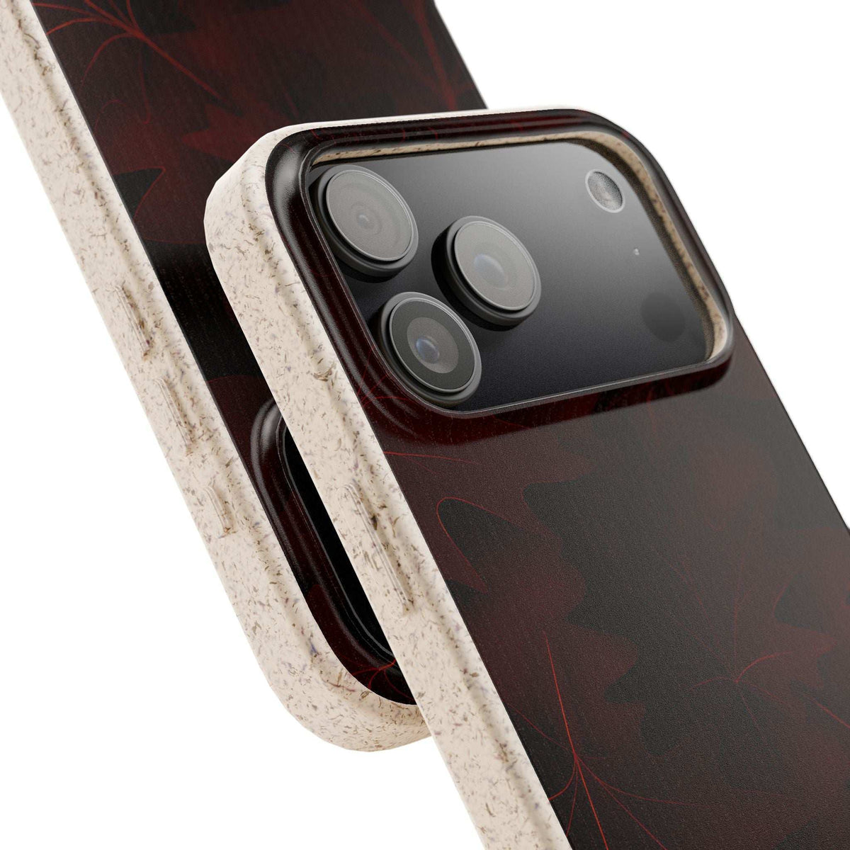 Phone case with dark red leaf design and beige textured border, side-by-side view