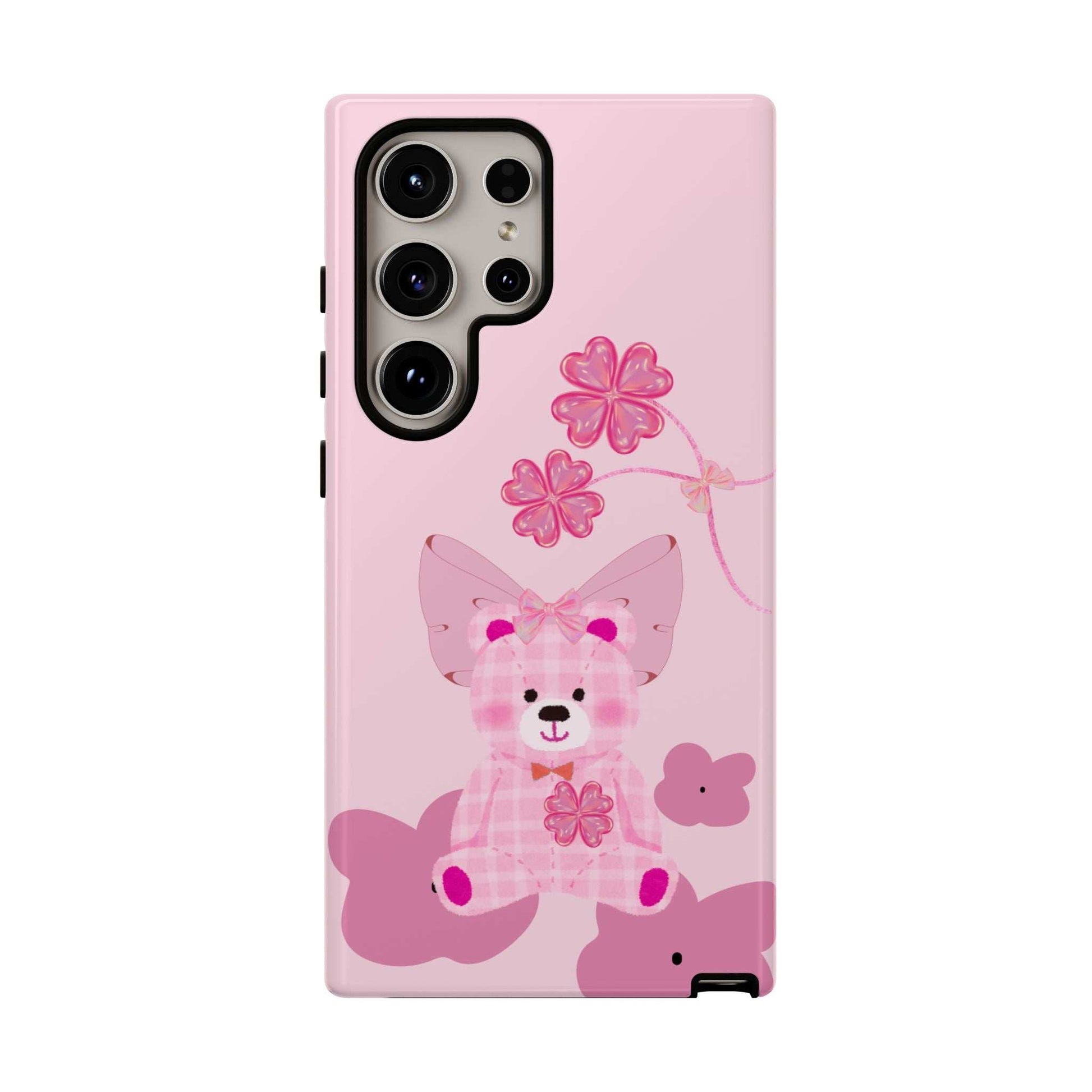 Pink teddy bear phone case with floral bow; back view and camera cutouts visible.