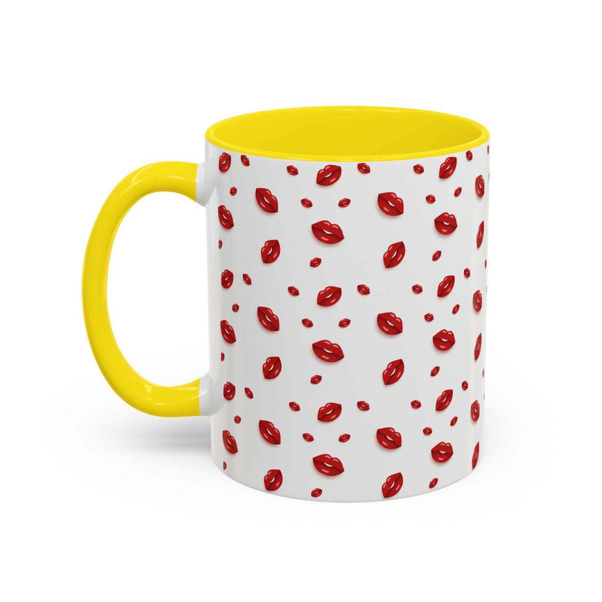Yellow-accent coffee mug with red lips pattern and yellow handle, angled view