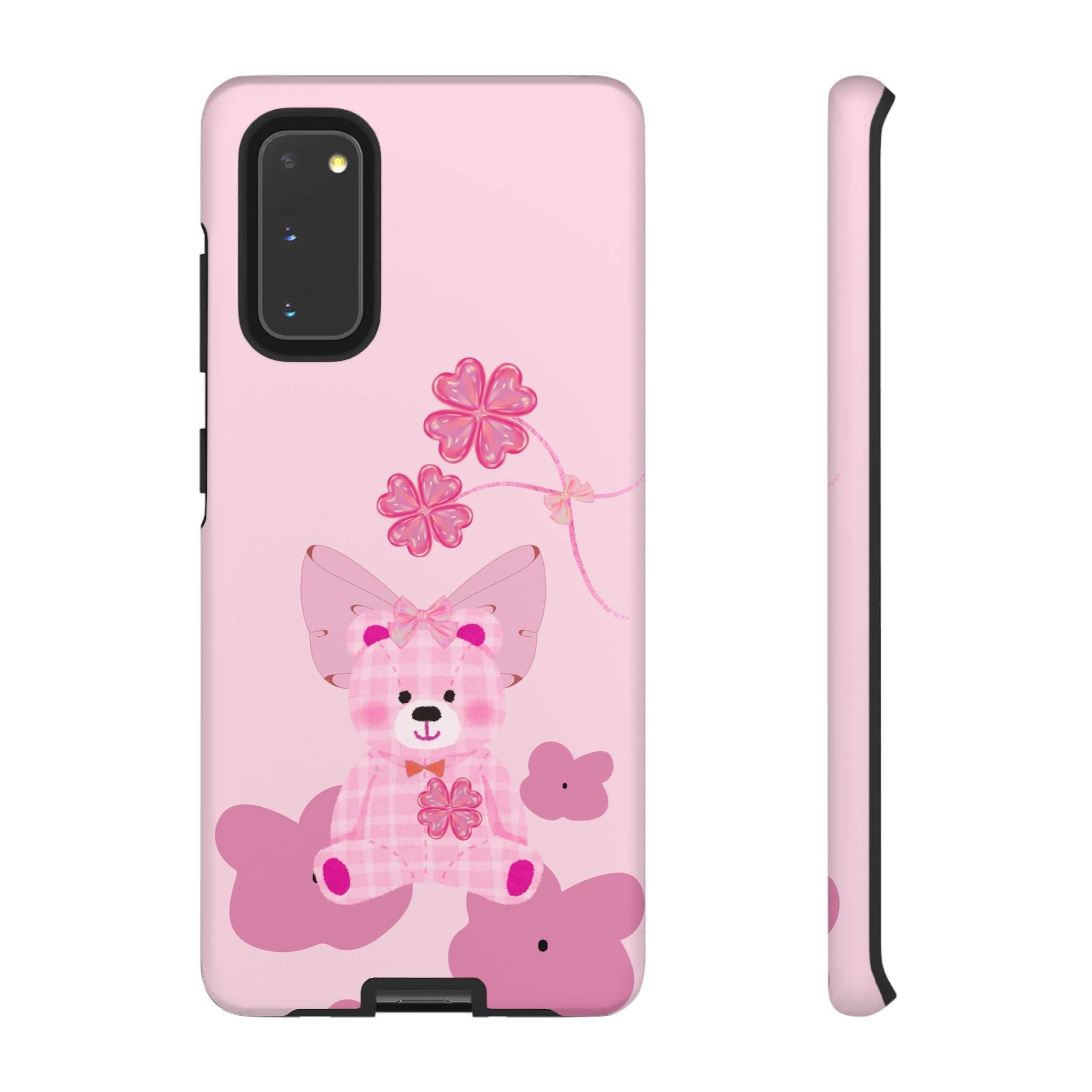 Pink phone case with teddy bear holding flowers; cutouts for dual camera and flash.