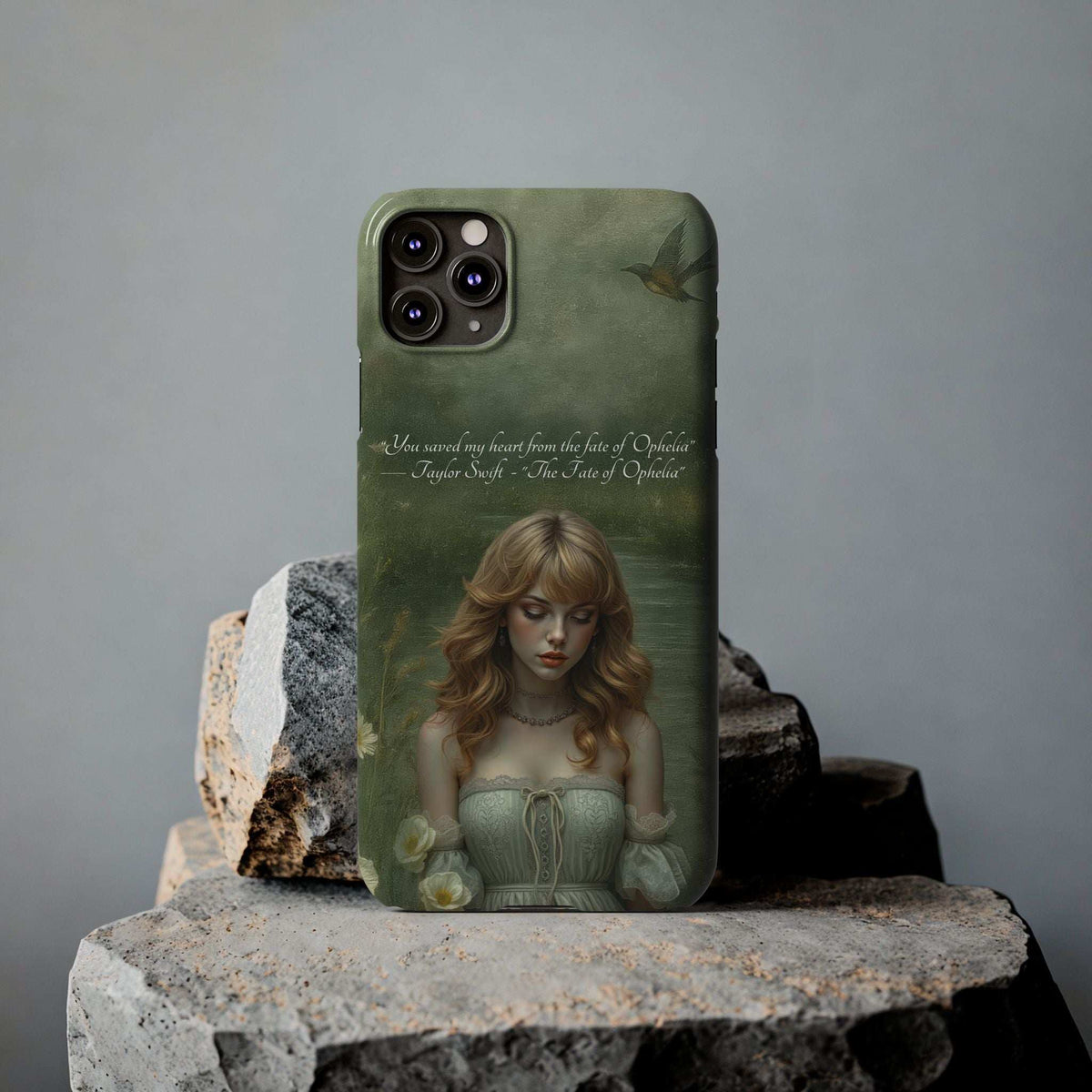 Green phone case on stone with blonde portrait, bird detail, and camera cutouts.