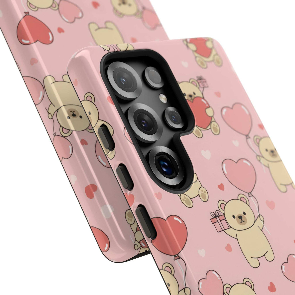 Pink phone case close-up with teddy bears and hearts, showing glossy camera lens covers