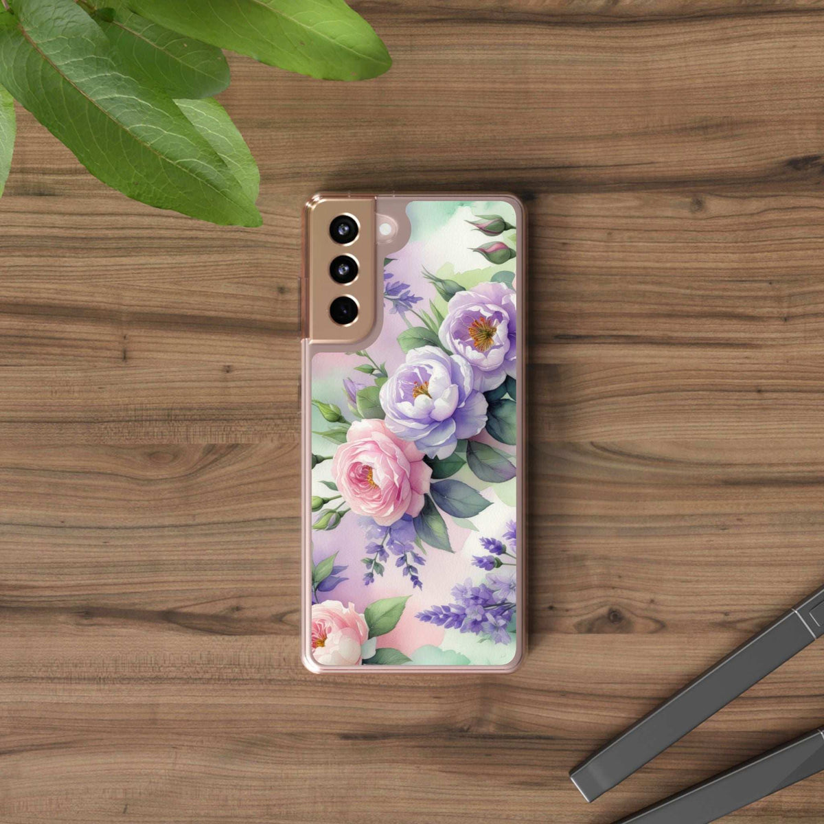 Clear floral phone case with pink and purple blossoms on a transparent shell
