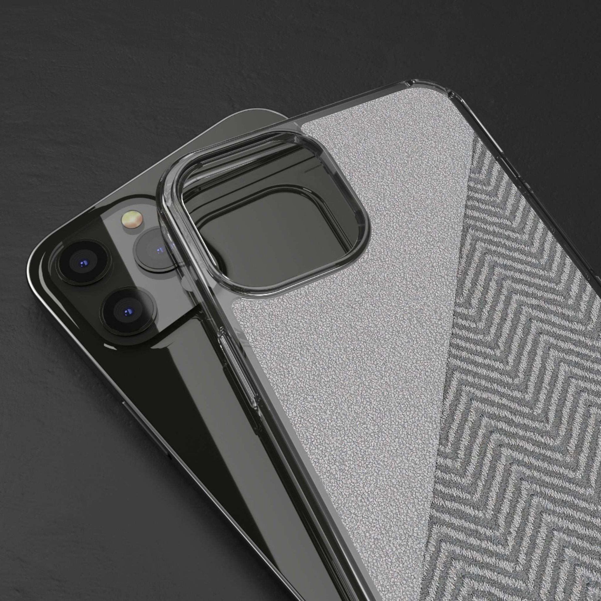 Tough phone case close-up with clear protective corners over speckled gray herringbone back