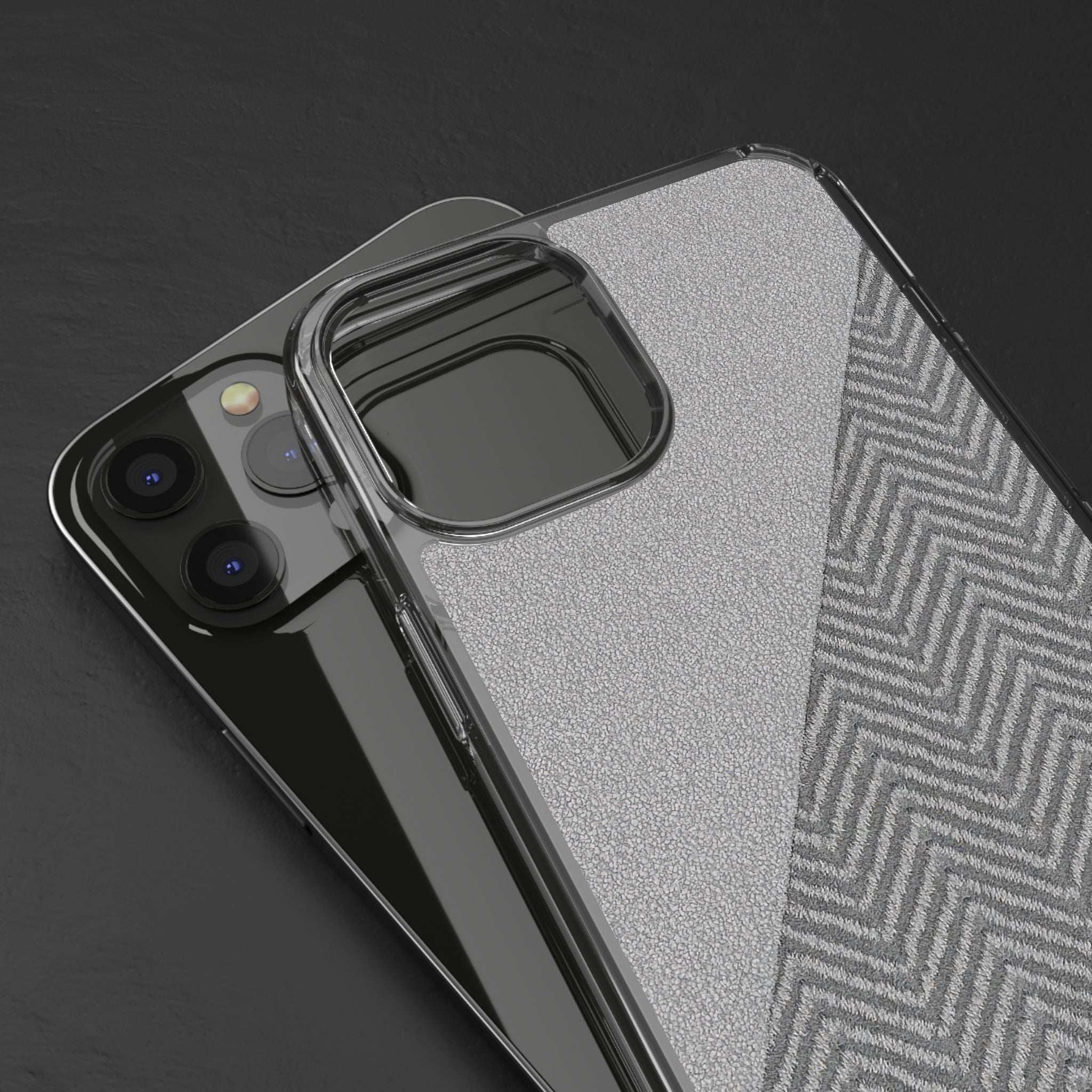 Tough phone case close-up with clear protective corners over speckled gray herringbone back