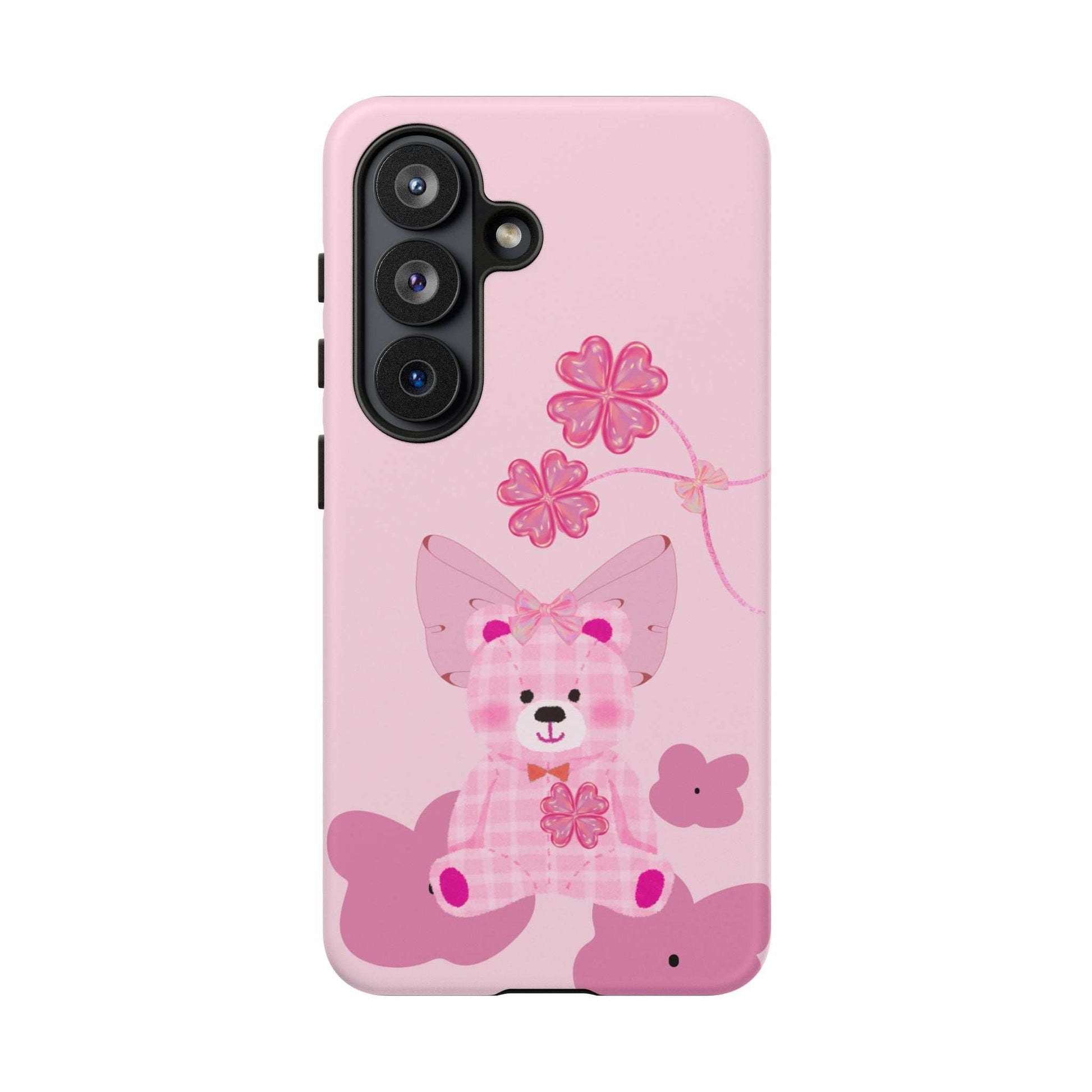Pink teddy bear phone case with bow and floral accents, vertical triple camera cutout