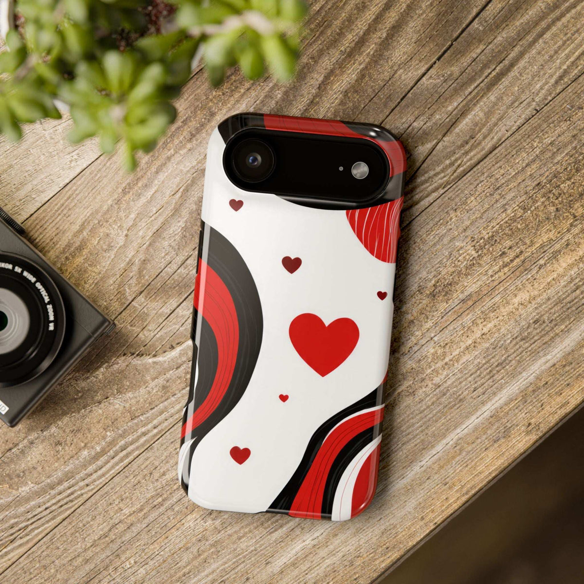 Glossy white phone case with red hearts and wavy stripes, camera openings visible