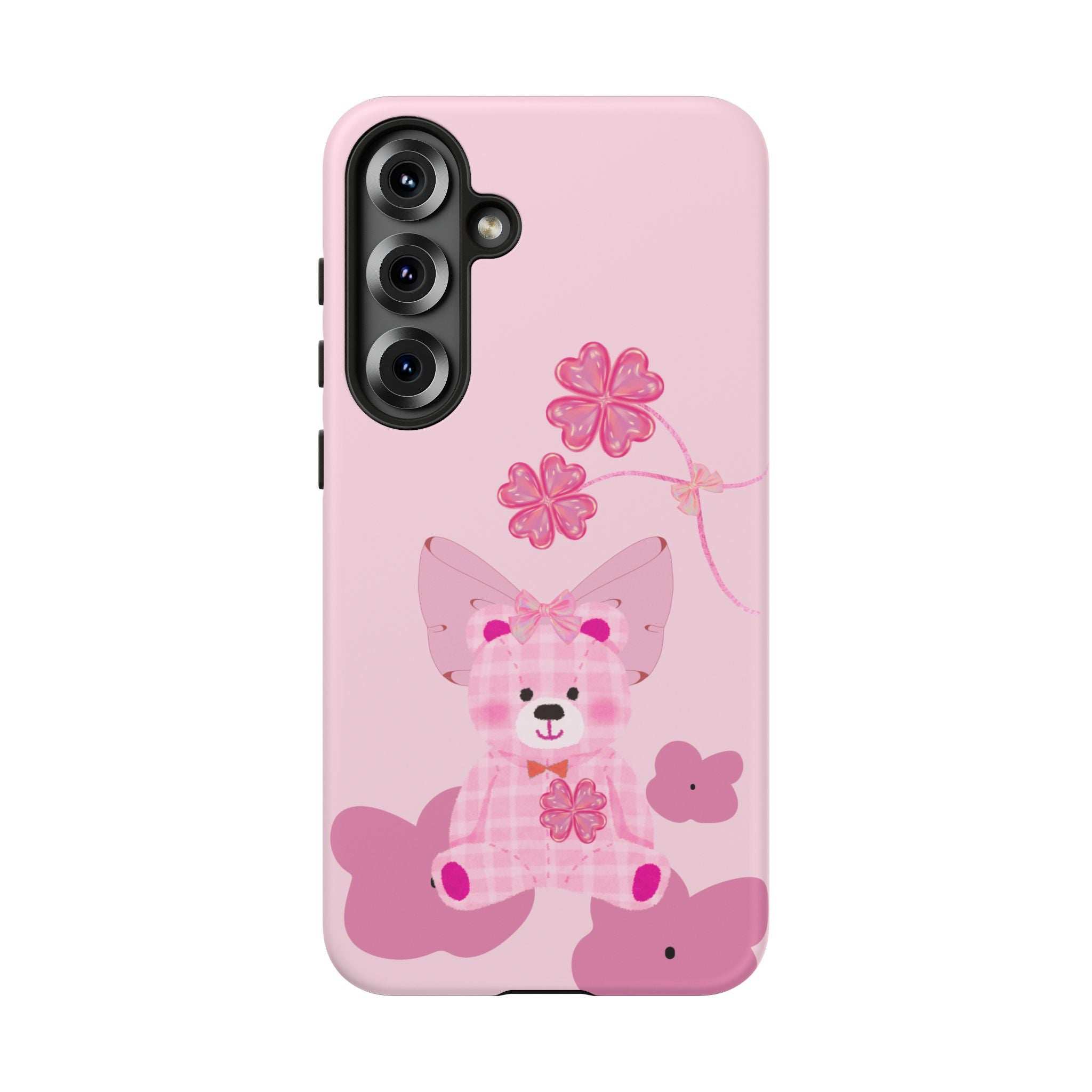 Pink phone case with teddy bear graphic, flower vines, and camera cutouts visible.