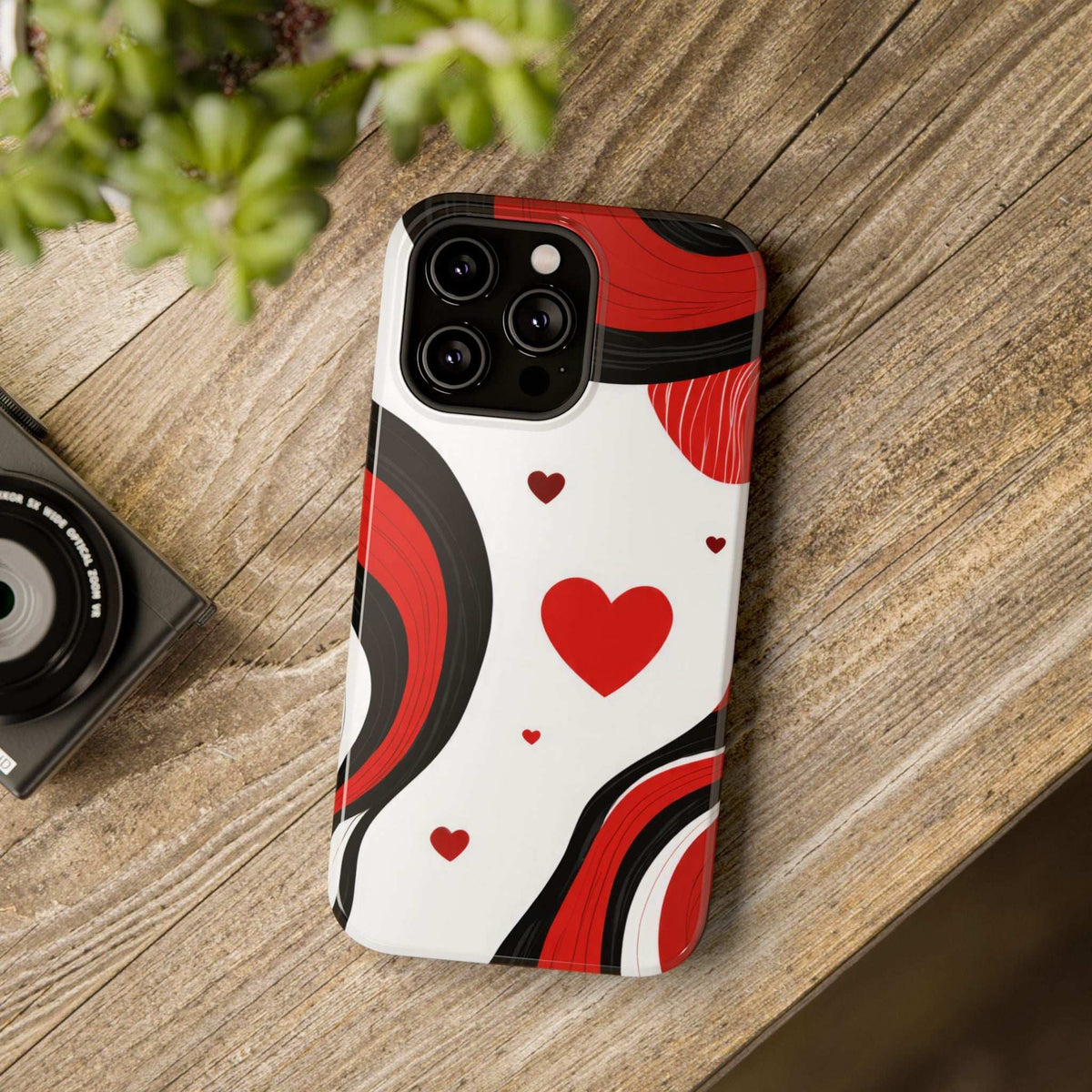 Phone case with large red heart, red-and-black wave graphics, and small hearts on white.