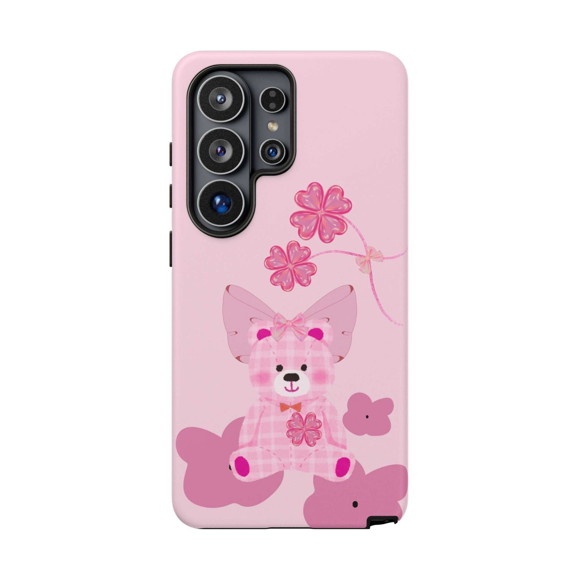 Pink teddy bear phone case with bow and flower accents, quad camera cutout