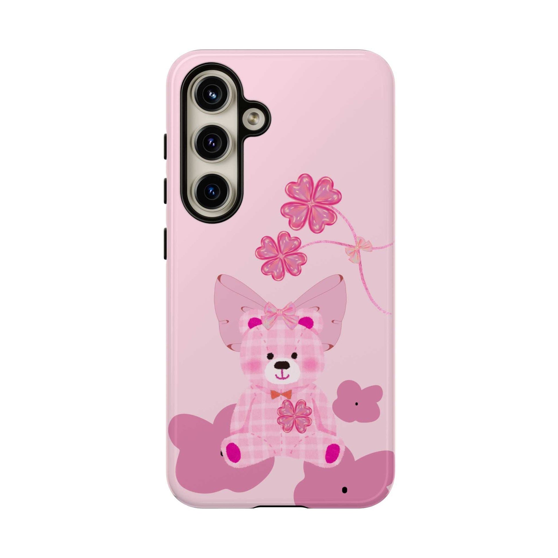 Pink phone case with teddy bear holding flowers and bow; camera cutouts visible