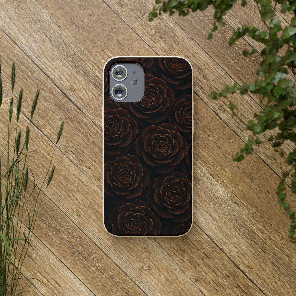 Wooden roses phone case with dark rose pattern and camera cutouts on light wood edges