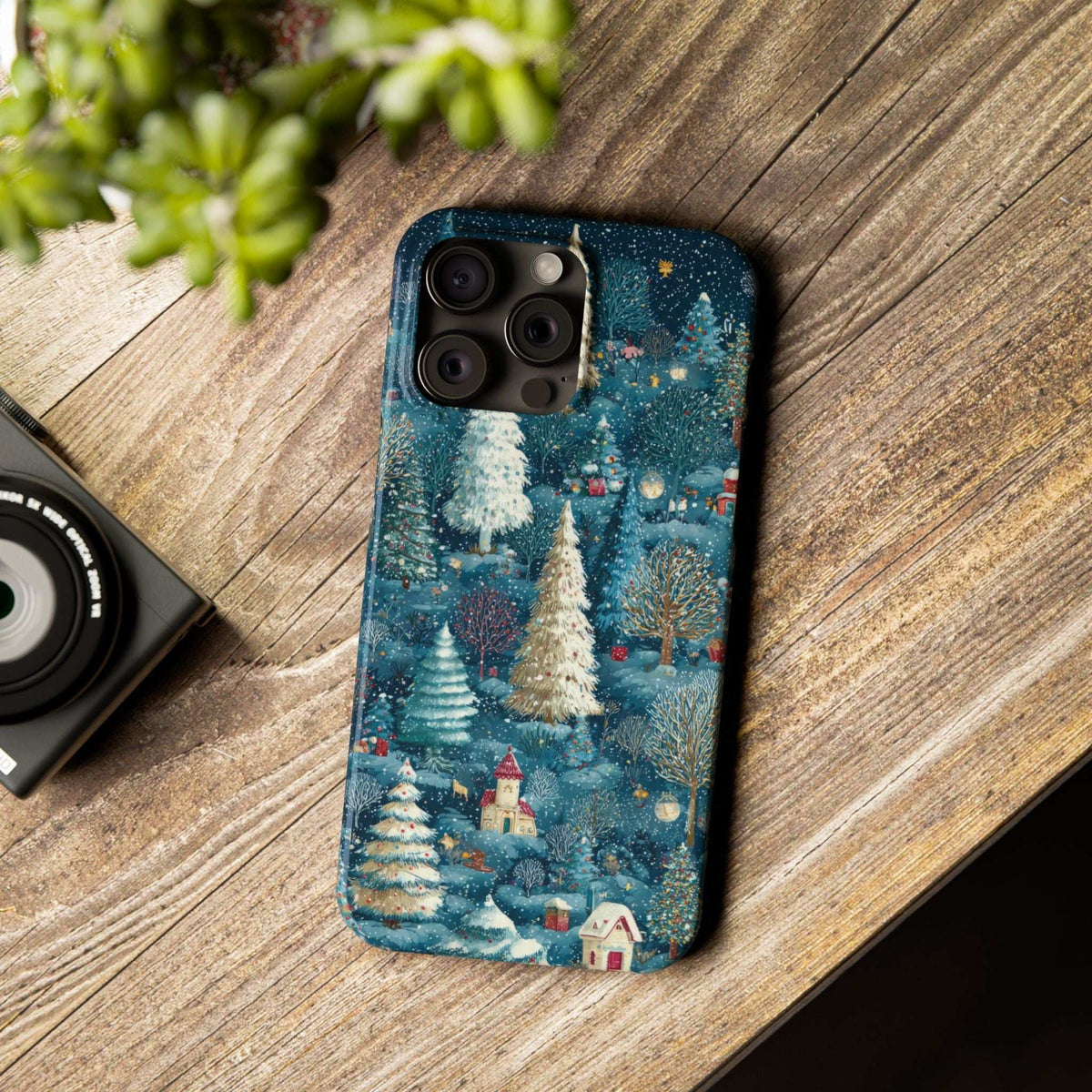 Blue winter forest phone case with snowy evergreens and cabin houses, camera cutouts