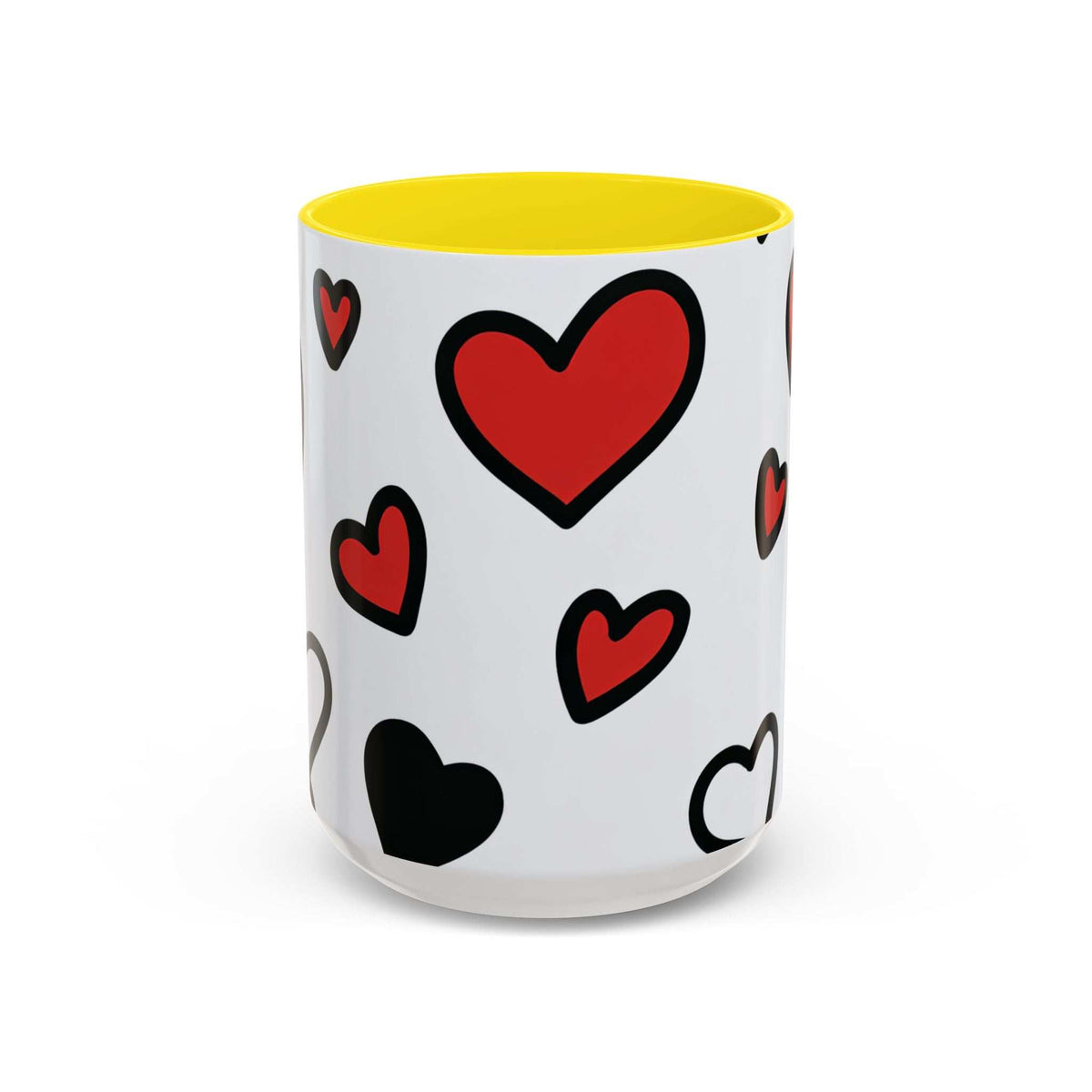 Accent coffee mug with yellow interior and rim, white body with red and black heart prints