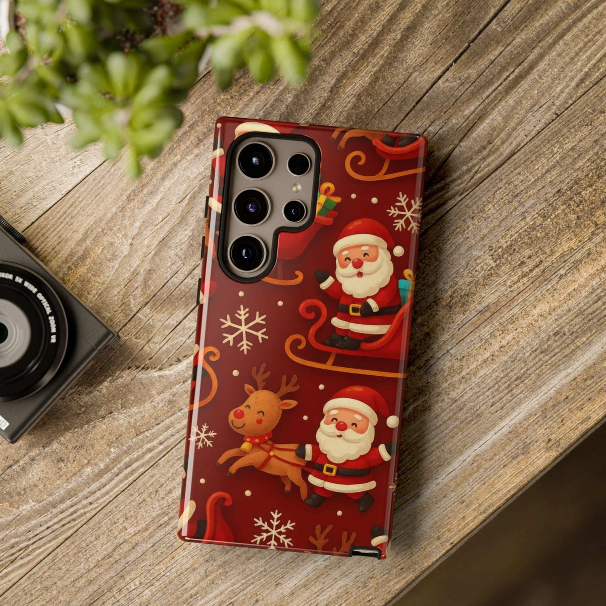 Glossy red phone case with Santa, reindeer and snowflake print, camera cutouts