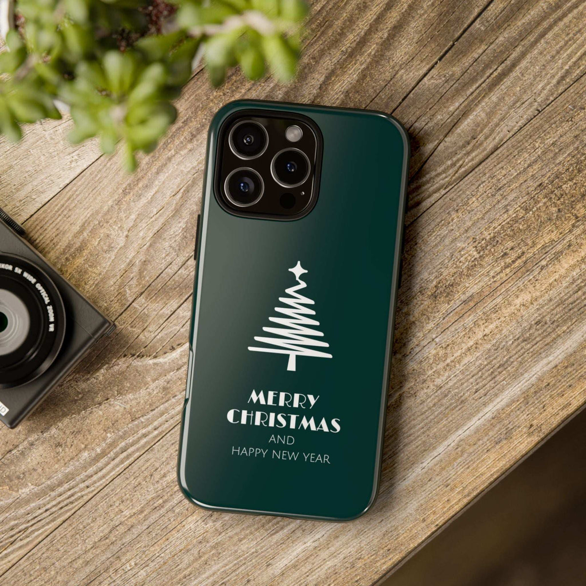 Teal glossy phone case with white Christmas tree graphic and Merry Christmas message
