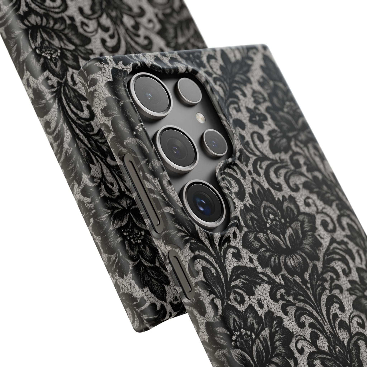 Black damask floral phone case, angled close view showing gray ornate texture