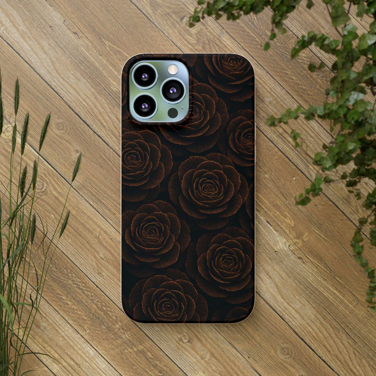 Black phone case with dark rose pattern and camera cutouts