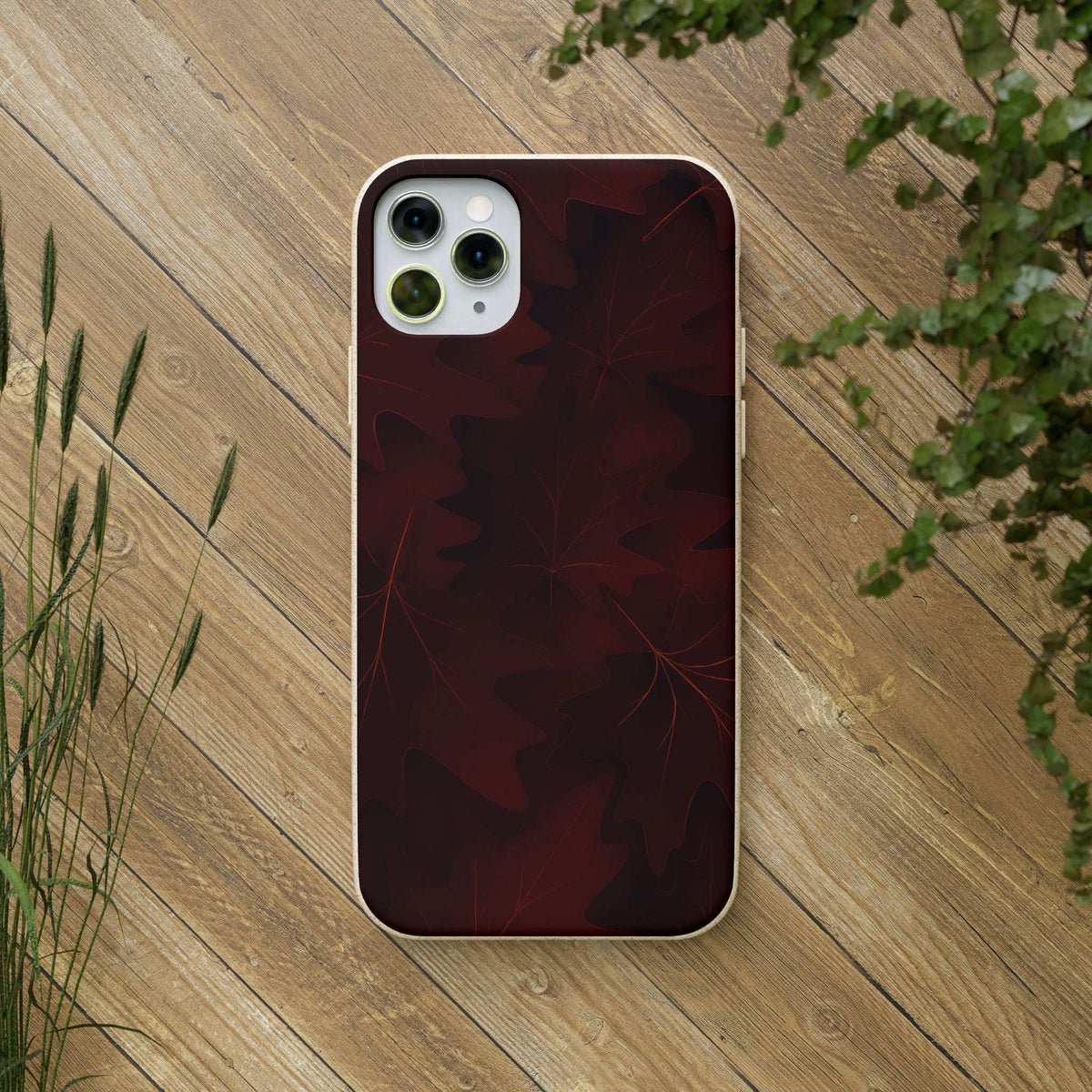 Burgundy phone case with leaf pattern and triple-camera cutout