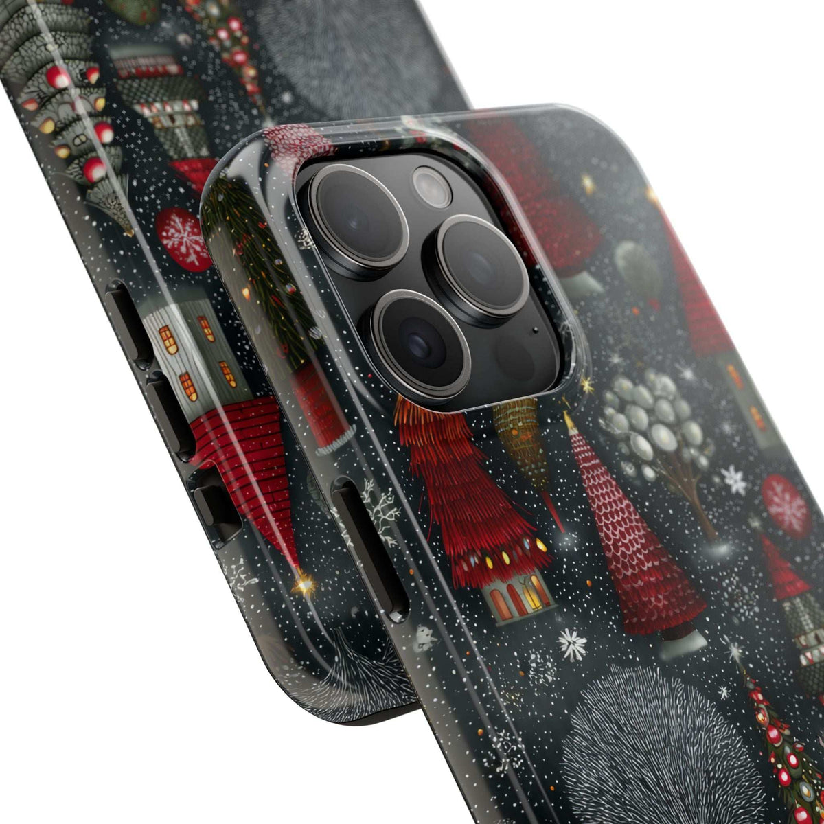 Phone case close-up with winter village print and protected triple camera lenses